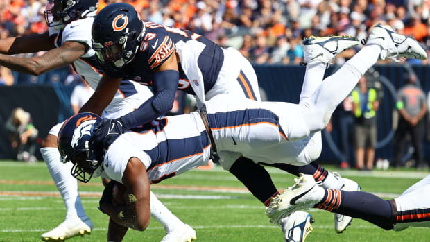 Oct 1, 2023; Chicago, Illinois, USA; Denver Broncos tight end Chris Manhertz (84) makes a catch against Chicago Bears linebacker T.J. Edwards (53) during the first half at Soldier Field.